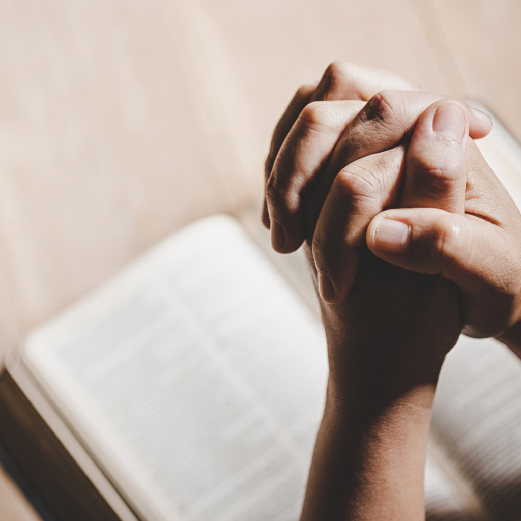 Faithful believer holding open Bible
